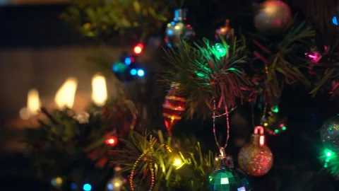 Christmas Tree With Colourful Ornaments and Lights with Fireplace Stock Footage