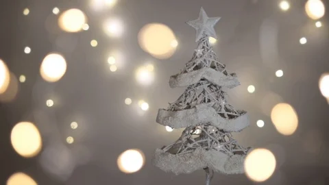 Christmas tree composition with falling snow and defocused lights. 4K Stock Footage 97894579