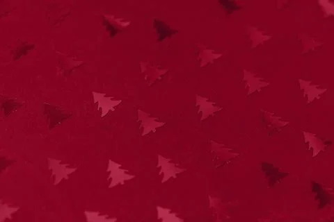 Christmas tree confetti pattern on green. Abstract background in trendy color of Stock Photos