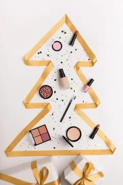 Christmas tree cookie cutter with makeup and nail polish Stock Photos