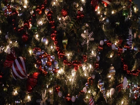 Christmas Tree Covered in Lights and Ornaments Background, 4K Stock Footage 70145953