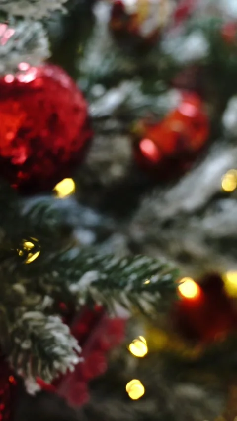 Christmas tree covered with snow in a house with Christmas decorations Stock Footage 296069949