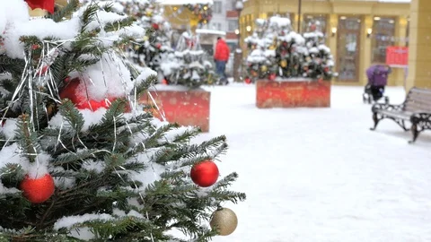 Christmas tree covered with snow, it is decorated with balls and toys. On the Video stock 100100599