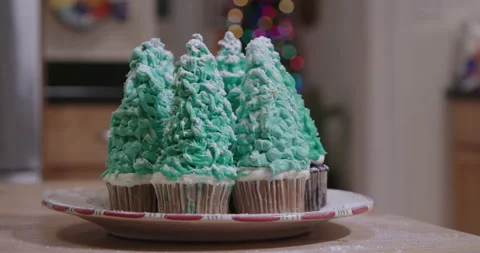 Christmas Tree Cupcakes on Kitchen Table Stock Footage 142090562