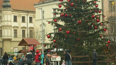 Christmas tree decorated flasks red, children kindergarten bell tower time lapse Stock Footage 100165027