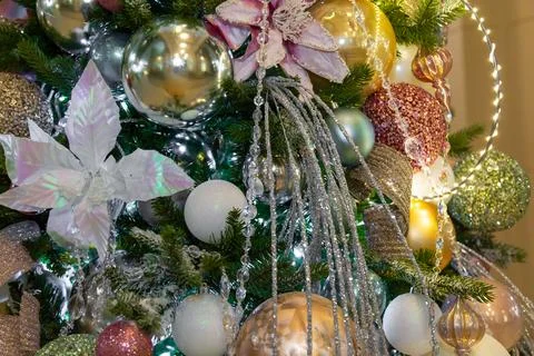 Christmas tree decorated with flower patterns and garlands Stock Photos
