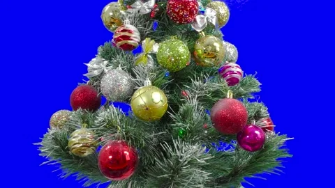 A Christmas tree decorated with large balls and flashing garlands of chroma key Stock Footage 171707342