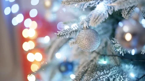 A Christmas tree decorated with lights and toys comes to life on the screen. Video stock 259084732