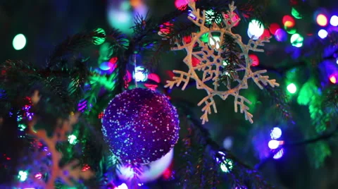 Christmas tree decorated with lights, toys at night Stock Footage 59585372
