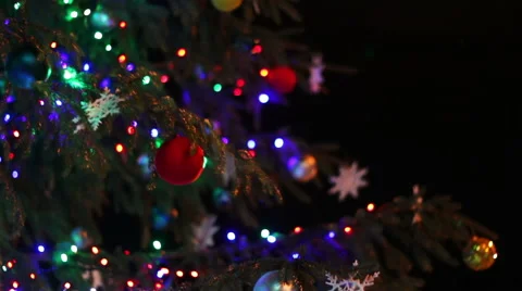 Christmas tree decorated with lights, toys at night Stock Footage 59589023