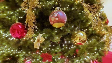 Christmas tree decorated with red and golden flowers, balls in big house Video stock 289216051