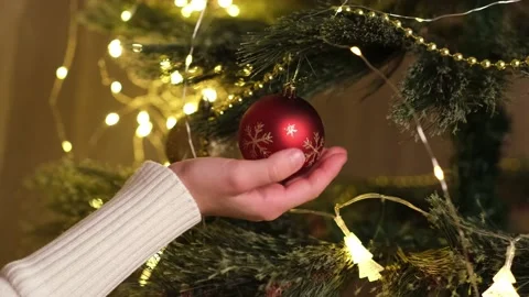 Christmas tree decorated with red ball and garland for family holiday Video stock 219862470