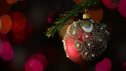 Christmas tree decorated red ball toy, Fir branch with balls and festive ligh Stock Footage 344434188