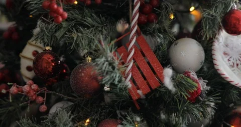 Christmas tree decorated with red balls, toys, berries, garlands on branches. Stock Footage 120160160