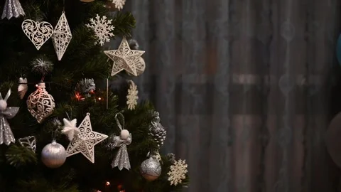Christmas tree decorated with silver, white ornaments, stars and snowflakes Stock Footage 320892522