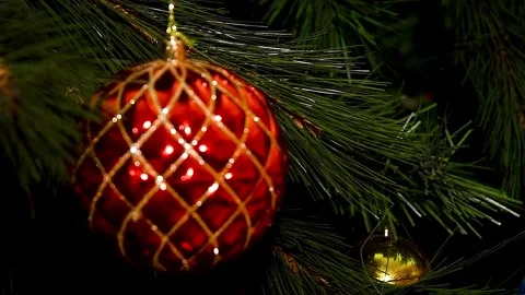 A Christmas tree decorated with various toys, garlands and lights hanging f.. Video stock 342389062