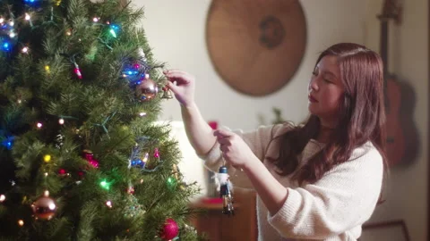 Christmas Tree Decorating 6K 48FPS SLO-MO Stock Footage 144463329