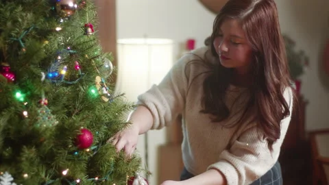 Christmas Tree Decorating 6K 48FPS SLO-MO Video stock 144463433