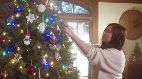 Christmas Tree Decorating 6K 48FPS SLO-MO Video stock 144463690