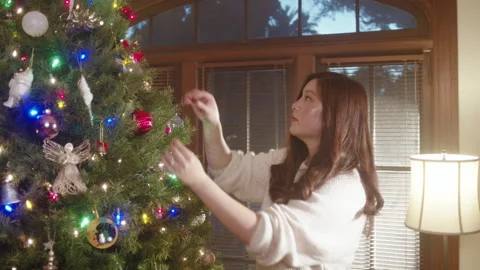 Christmas Tree Decorating 6K 48FPS SLO-MO Video stock 144464014