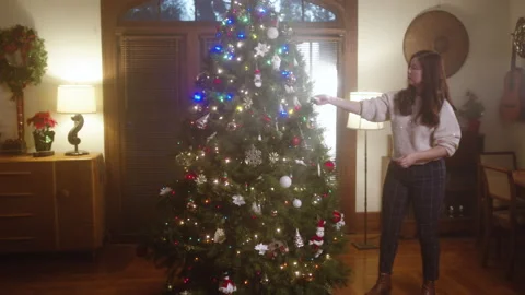Christmas Tree Decorating 6K 48FPS SLO-MO Video stock 144464080