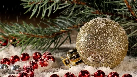 Christmas tree decoration with falling snow on gold ball Stock Footage 255490167