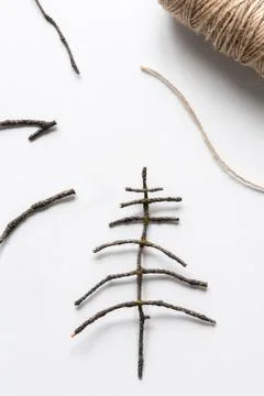 Christmas tree decoration made from natural materials of branches. Flat lay,  Stock Photos