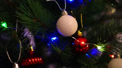 Christmas tree decorations and lights glittering at night. Stock Footage 135762275