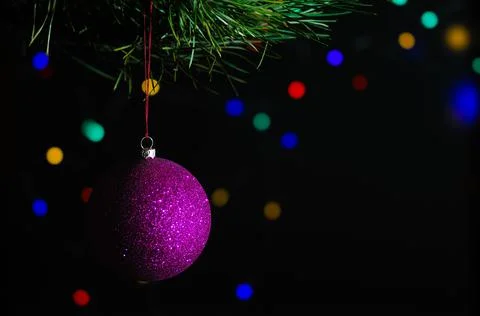 Christmas tree with decorations and lights on a black background Stock Photos