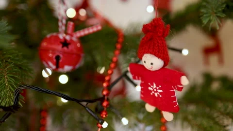 Christmas tree decorations and red handmade doll Stock Footage 145297380