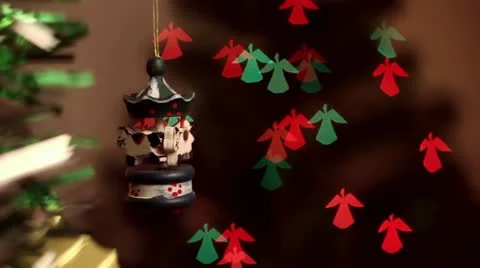 Christmas-tree decorations on angel-shaped background Stock Footage 12498366