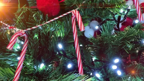 Christmas Tree Decorations with candy canes and flashing garlands. New year a Video stock 142161875