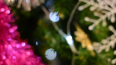 Christmas tree decorations close-up with variable focus under low lighting.  Chr Stock Footage 145659920