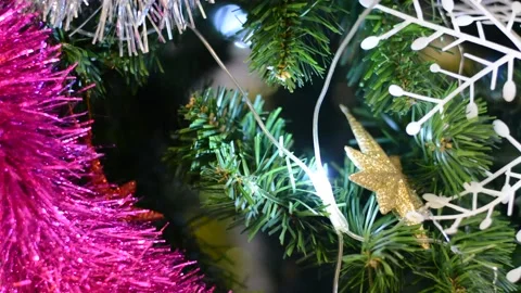 Christmas tree decorations close-up with variable focus under low lighting.  Chr Stock Footage 145659927