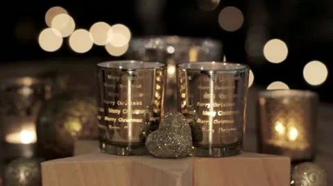 Christmas tree decorations, tealights and a wooden star Stock Footage 24669109
