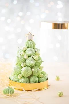 Christmas tree dessert treats made with green meringues with candy cane Stock Photos