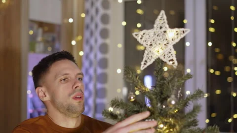 Christmas tree falls down while decorating. Stock Footage 250663103