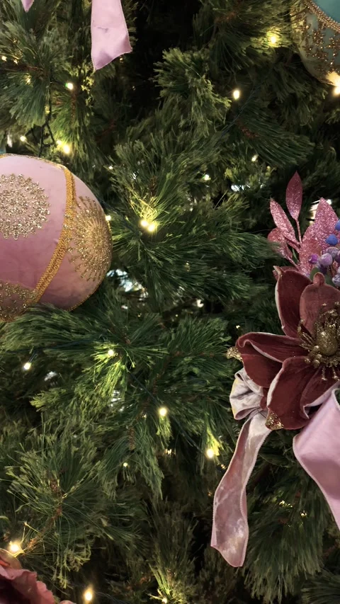 Christmas tree features a pale teal ornament with gold embroidery 動画素材 323300856