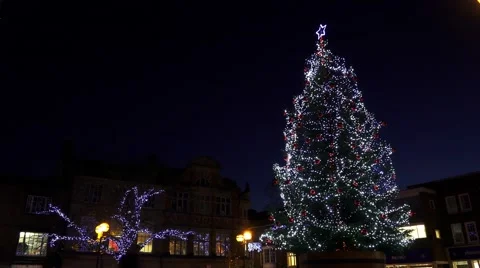 Christmas tree festive urban street scene Stock Footage