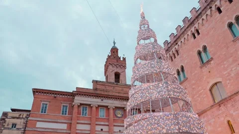 Christmas tree in Foligno main square with historic palace background Italy Stock Footage 327678348