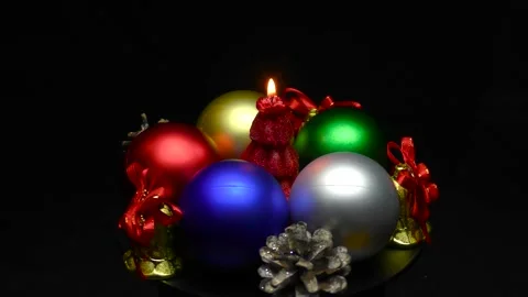 A Christmas tree in the form of a burning candle is spinning on a stand Stock Footage 165090122