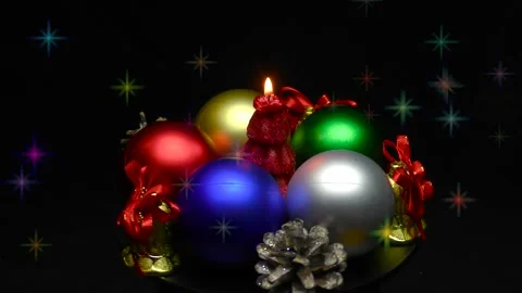 A Christmas tree in the form of a burning candle is spinning on a stand Stock Footage 165090125
