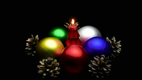 A Christmas tree in the form of a burning candle is spinning on a stand 動画素材 165090140