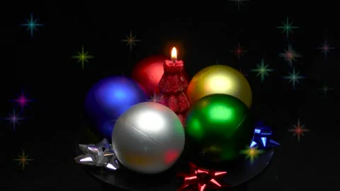 A Christmas tree in the form of a burning candle is spinning on a stand Stock Footage 165090143