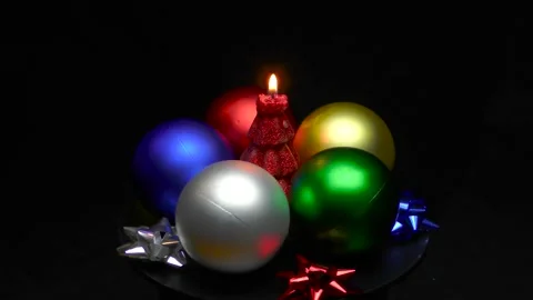 A Christmas tree in the form of a burning candle is spinning on a stand Stock Footage 165090153
