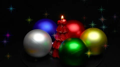 A Christmas tree in the form of a burning candle is spinning on a stand Stock Footage 165090157