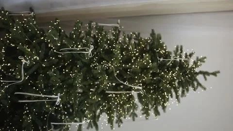 Christmas tree with garlands and decor in a bright room Stock Footage 295504441