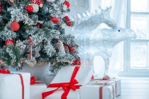Christmas Tree Gift Boxes In Interior With deer. christmas card. Christmas tr Stock Photos