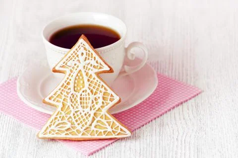 Christmas tree gingerbread with coffe cup on wooden background, toned Stock Photos