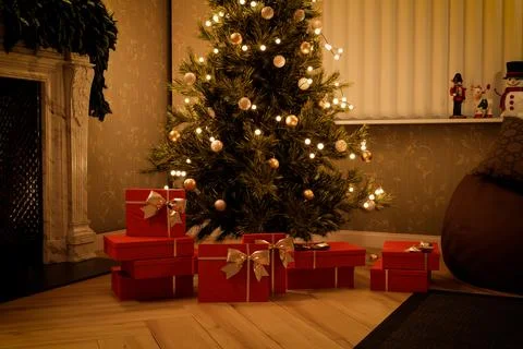 Christmas tree with glowing lights and red presents. 3d render Stock Illustration